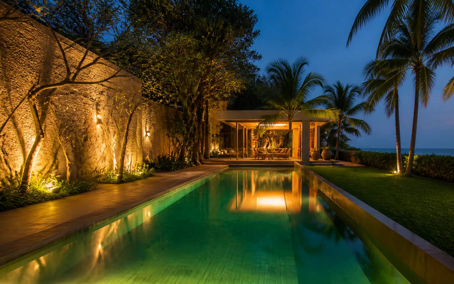 Seaface Villa pool garden at dusk